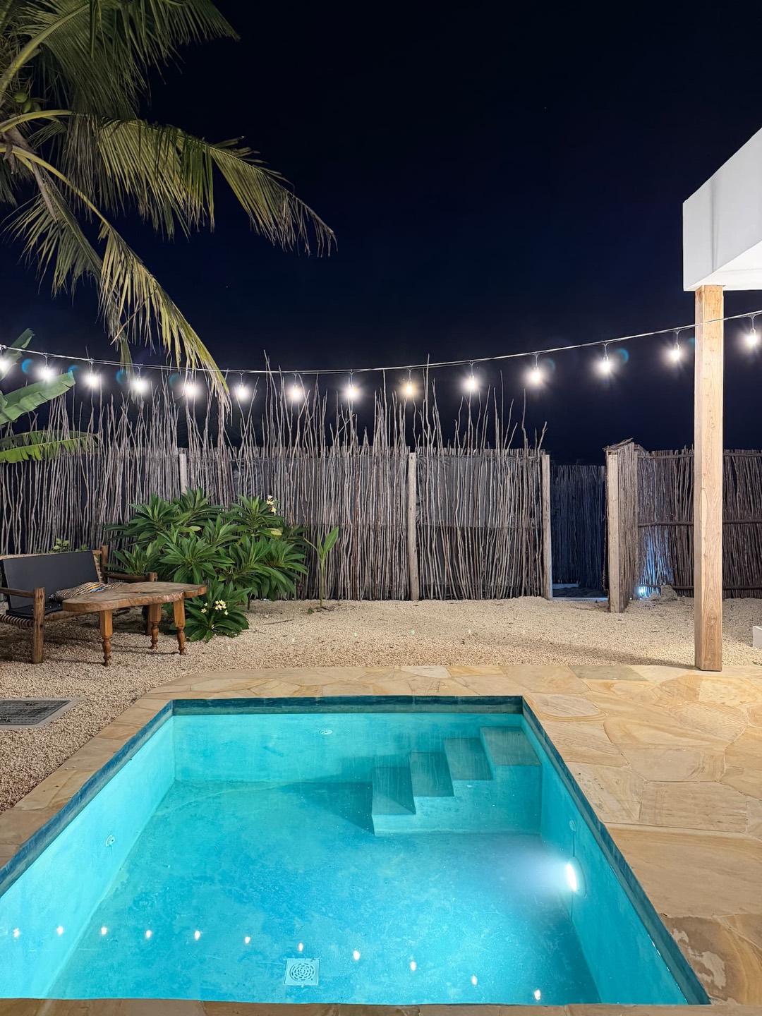Private pool lit at night